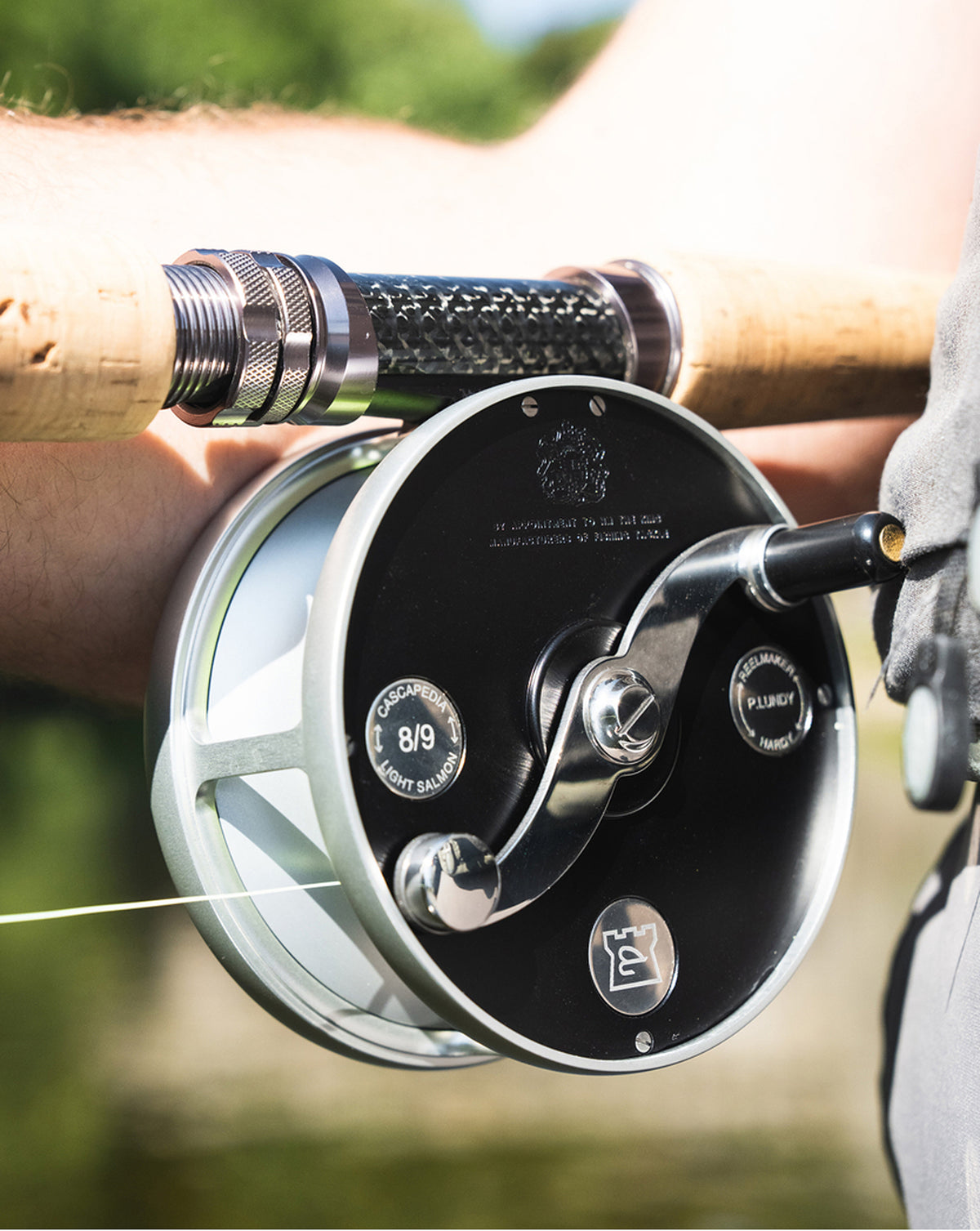 Close-up of a Hardy Cascapedia fly reel mounted on a two-handed fly rod.