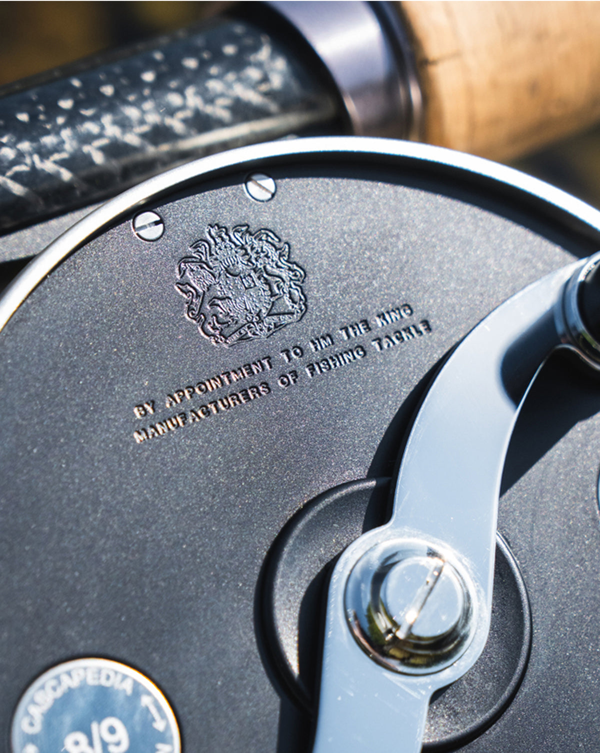 Close-up of a Hardy Cascapedia fly reel featuring the Royal Warrant crest and handcrafted details.