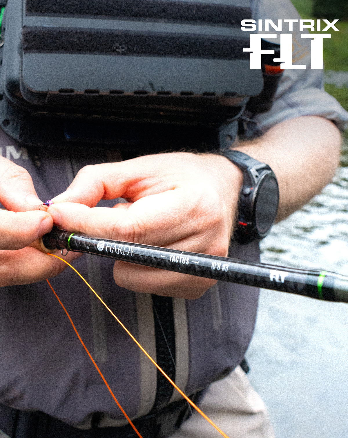 Close-up of an angler rigging a Hardy Tactus fly rod featuring SINTRIX FLT technology.
