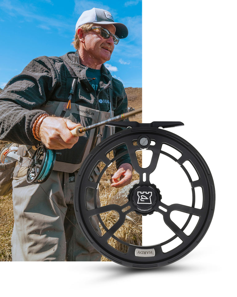 Man holding a fishing reel with outdoor scenery and close-up of the reel.