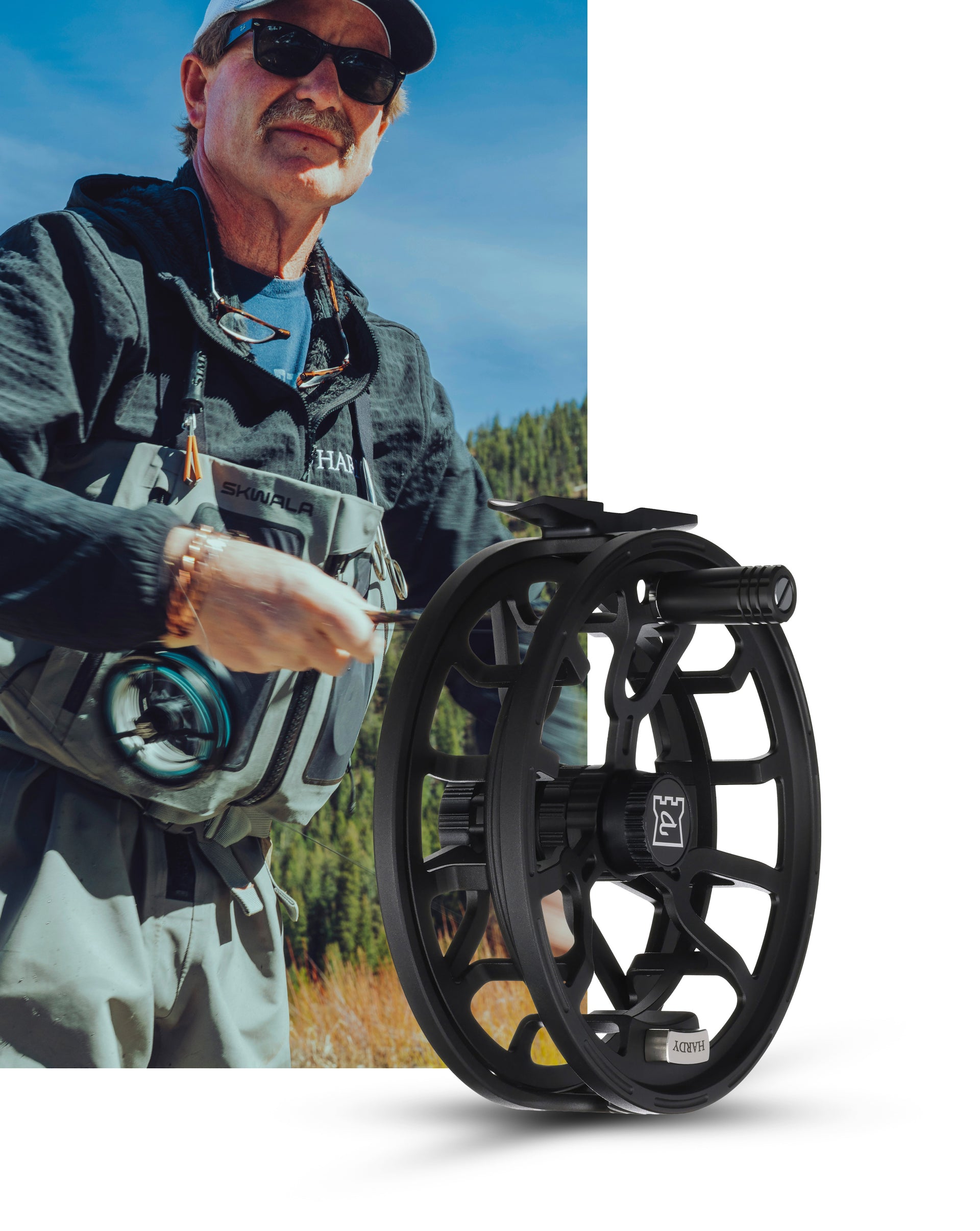 Man holding a fishing reel with a blurred outdoor background