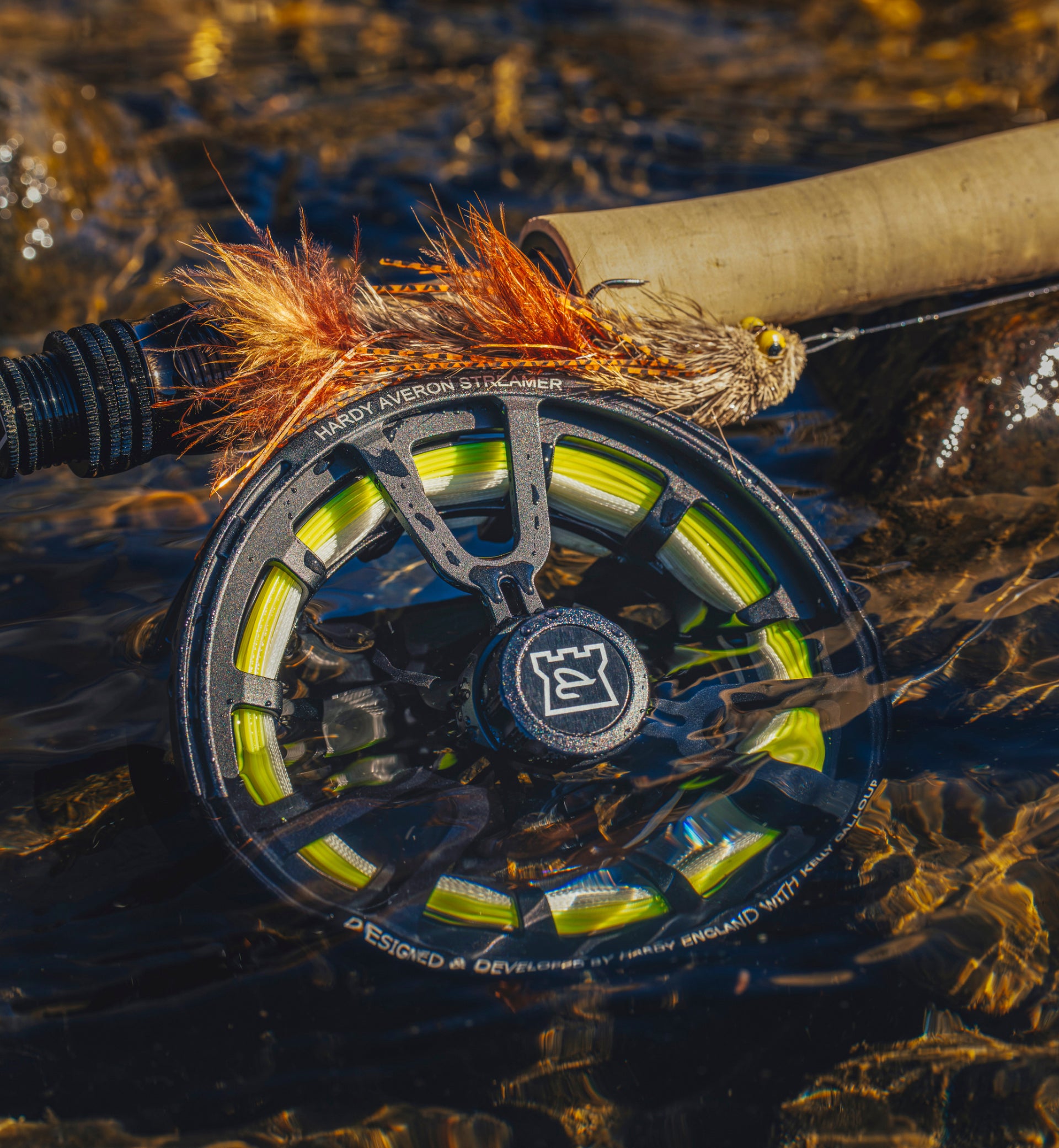 Close-up of a fishing reel with water in the background